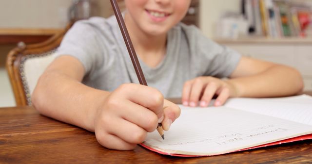 Child Writing in Notebook at Home Desk - Download Free Stock Images Pikwizard.com