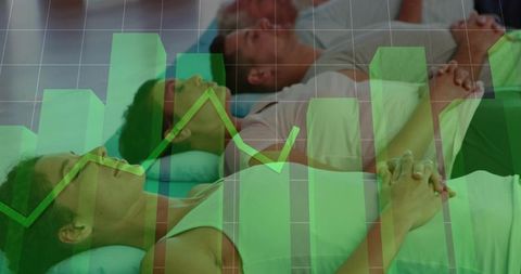 Group practicing guided relaxation on mats with green data overlay and wellness concept