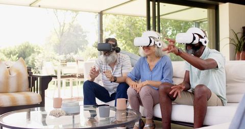 Seniors Engaging in Virtual Reality Experience Together at Home
