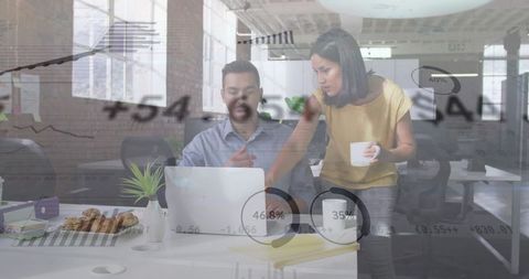 Collaborating over data-driven laptop presentation in modern industrial office space