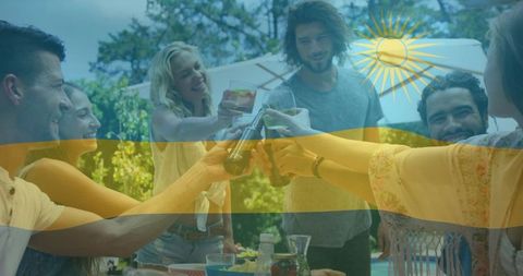 Summertime reunion: friends toasting around poolside table