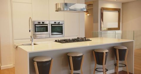 Modern White Kitchen Island with Gas Cooktop and Seating