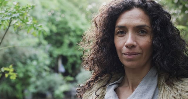 Portrait of Confident Mature Woman with Curly Hair in Outdoors Setting - Download Free Stock Images Pikwizard.com