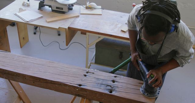 Woodworker Polishing Wooden Beam in Workshop - Download Free Stock Images Pikwizard.com