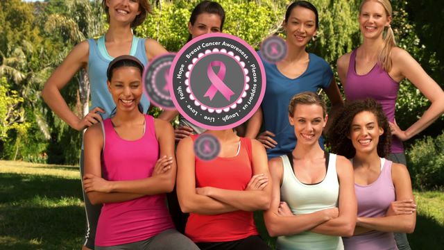 Diverse group of women smiles while promoting breast cancer awareness with pink ribbons. Outdoor setting showcases unity and support for health initiatives. Suitable for health campaigns, breast cancer awareness month materials, and wellness blogs highlighting community support.