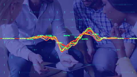 Team Analyzing Financial Data on Tablet Device