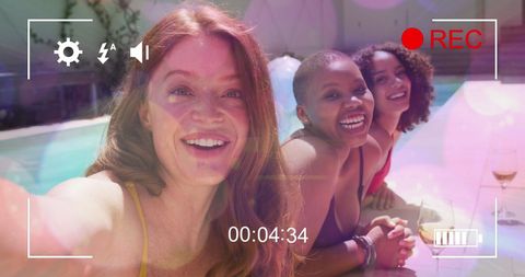 Diverse Female Friends Enjoying Vacation by Poolside