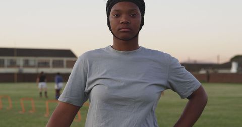 Confident African American Teenage Girl on Sports Field