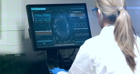 Female Scientist Analyzing Data on Interactive Computer Display - Download Free Stock Images Pikwizard.com