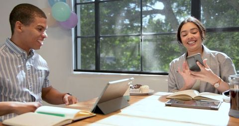 Joyful Business Duo Celebrating with Office Balloons
