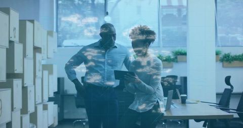 Business professionals reviewing cyber security data in modern office