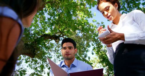 Waitress Taking Order from Couple in Outdoor Restaurant