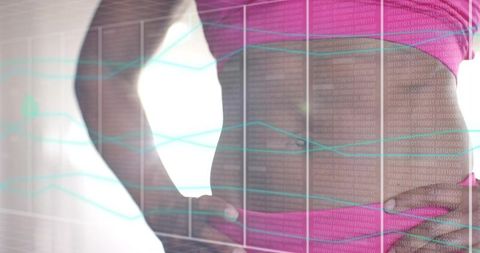 Woman Adjusting Waistband Showing Navel in Pink Activewear with Digital Health Data Overlay