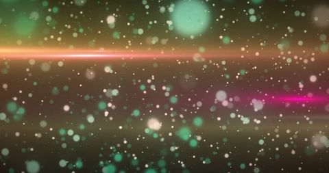 Drifting teal and magenta bokeh with orange flare and cosmic dust for abstract backgrounds