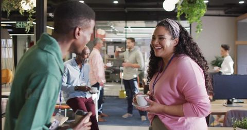 Colleagues Socializing in Modern Office Lounge