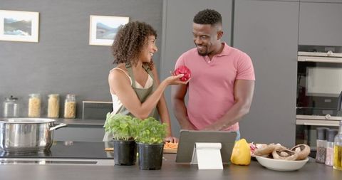 Couple Cooking Together with Fresh Vegetables in Modern Kitchen