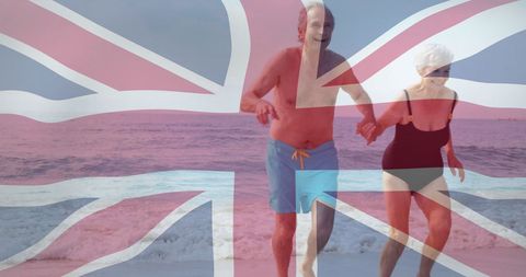 Joyful Seniors Enjoying Beach Holiday with National Pride