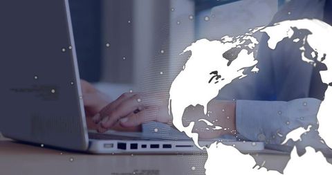 Businessman Typing on Laptop with World Map Overlay