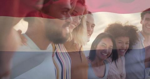 Diverse Friends Enjoying Beach Sunset with Flag Overlay