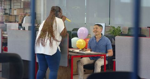 Office Birthday Celebration with Balloons and Cake