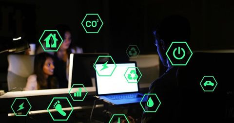 Young Professionals Working on Eco-Friendly Tech Innovation in Office