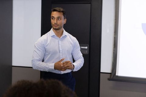 Young Professional Delivering Business Presentation