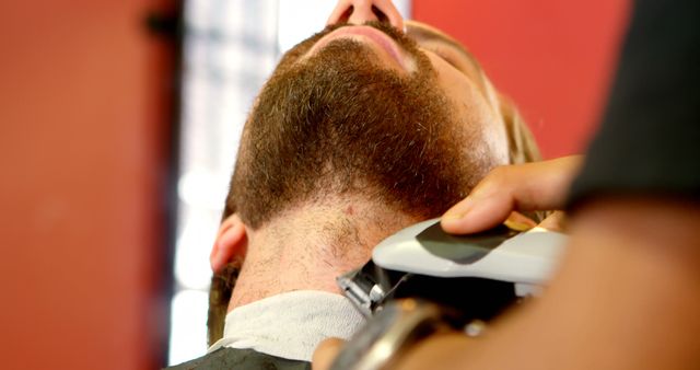 Close-up of Barber Trimming Beard with Electric Trimmer - Download Free Stock Images Pikwizard.com