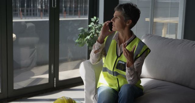 Female Architect Discussing Project on Smartphone in Bright Office - Download Free Stock Images Pikwizard.com