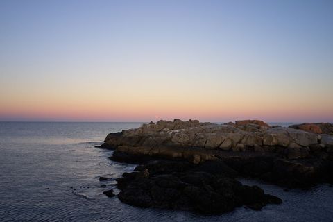 Rocky coastline basking in the sunset glow