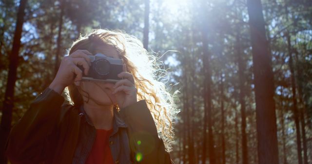 Woman Taking Photo With Vintage Camera in Forest - Download Free Stock Images Pikwizard.com