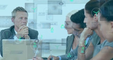 Business Team Discussing Sustainability with Futuristic Technology