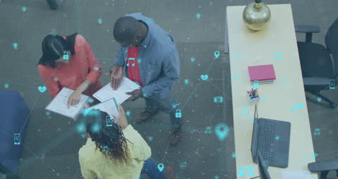 Diverse Team Collaborating with Digital Technology Overlay