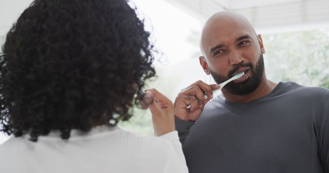 Couple Brushing Teeth Together in Bathroom Morning Routine - Download Free Stock Images Pikwizard.com