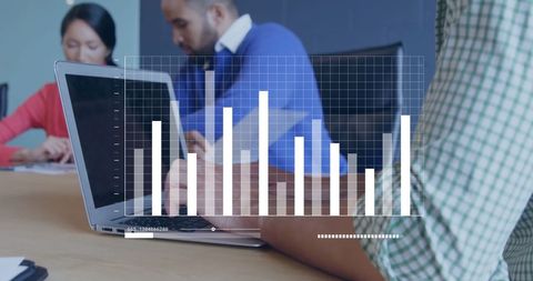 Colleagues Analyzing Data with Laptop and Digital Graphs - Download Free Stock Images Pikwizard.com