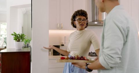Friends Conversing in Modern Kitchen Space