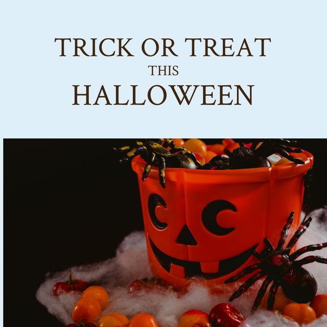 Composition of trick or treat this halloween text over candy and spiders on blue background. Halloween tradition and celebration concept digitally generated image.