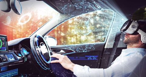 Businessman experiencing futuristic driving in autonomous car with vr