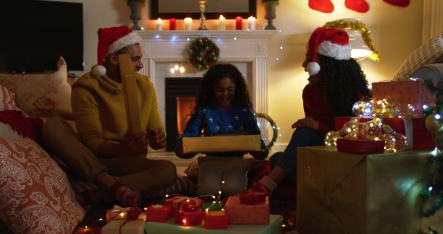 Happy Family Opening Christmas Gifts by Fireplace - Download Free Stock Images Pikwizard.com