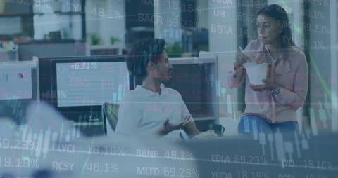 Diverse Business Team Collaborating Amid Financial Data Visualization