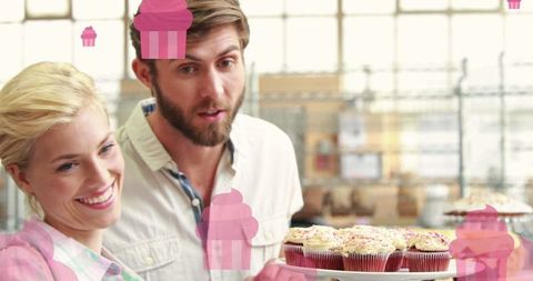 Happy Couple Shopping for Cupcakes in Bakery