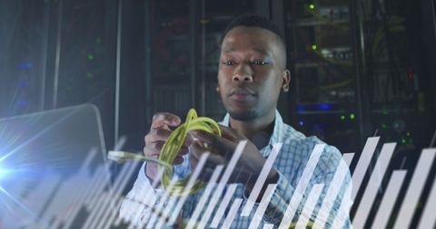It technician analyzing data in innovative server room environment