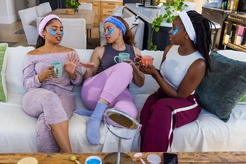 African american friends having at-home spa night with under-eye gel patches