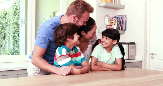 Happy Family Enjoying Time Together at Kitchen Table - Download Free Stock Images Pikwizard.com