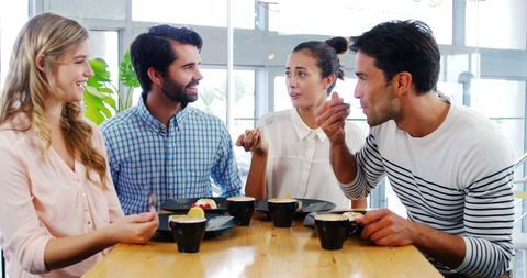 Young Friends Socializing Over Coffee and Dessert in Relaxed Cafe - Download Free Stock Images Pikwizard.com