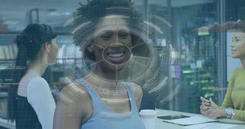 Smiling woman leading coworking team meeting with augmented reality hud and coffee