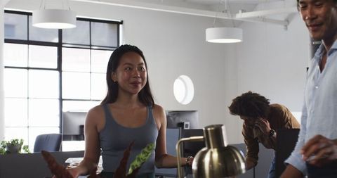 Multinational Team Collaborating in Modern Office Environment