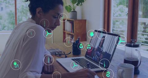 Businesswoman Analyzing Digital Charts in Home Office with Modern Technology