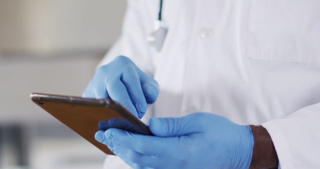 Doctor Using Smartphone with Protective Gloves in Medical Office - Download Free Stock Images Pikwizard.com