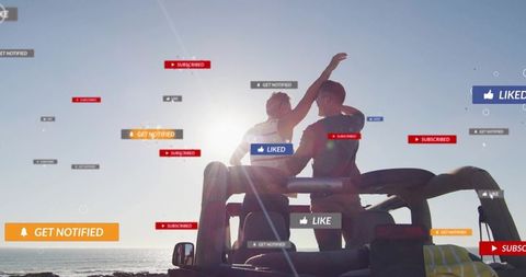 Two friends in convertible at coastal sunset with floating social media notifications