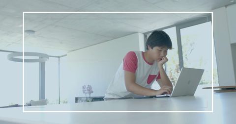 Young Asian Businessman Analyzing Financial Data on Laptop in Office - Download Free Stock Images Pikwizard.com